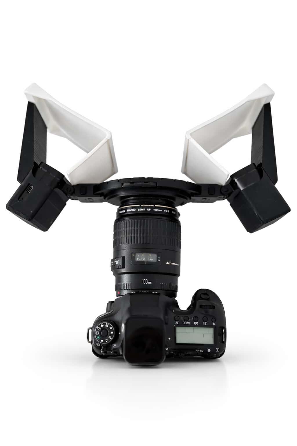 Camera with a white light stand on a white background