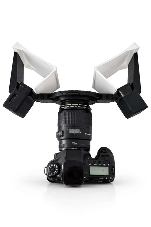 Camera with a white light stand on a white background