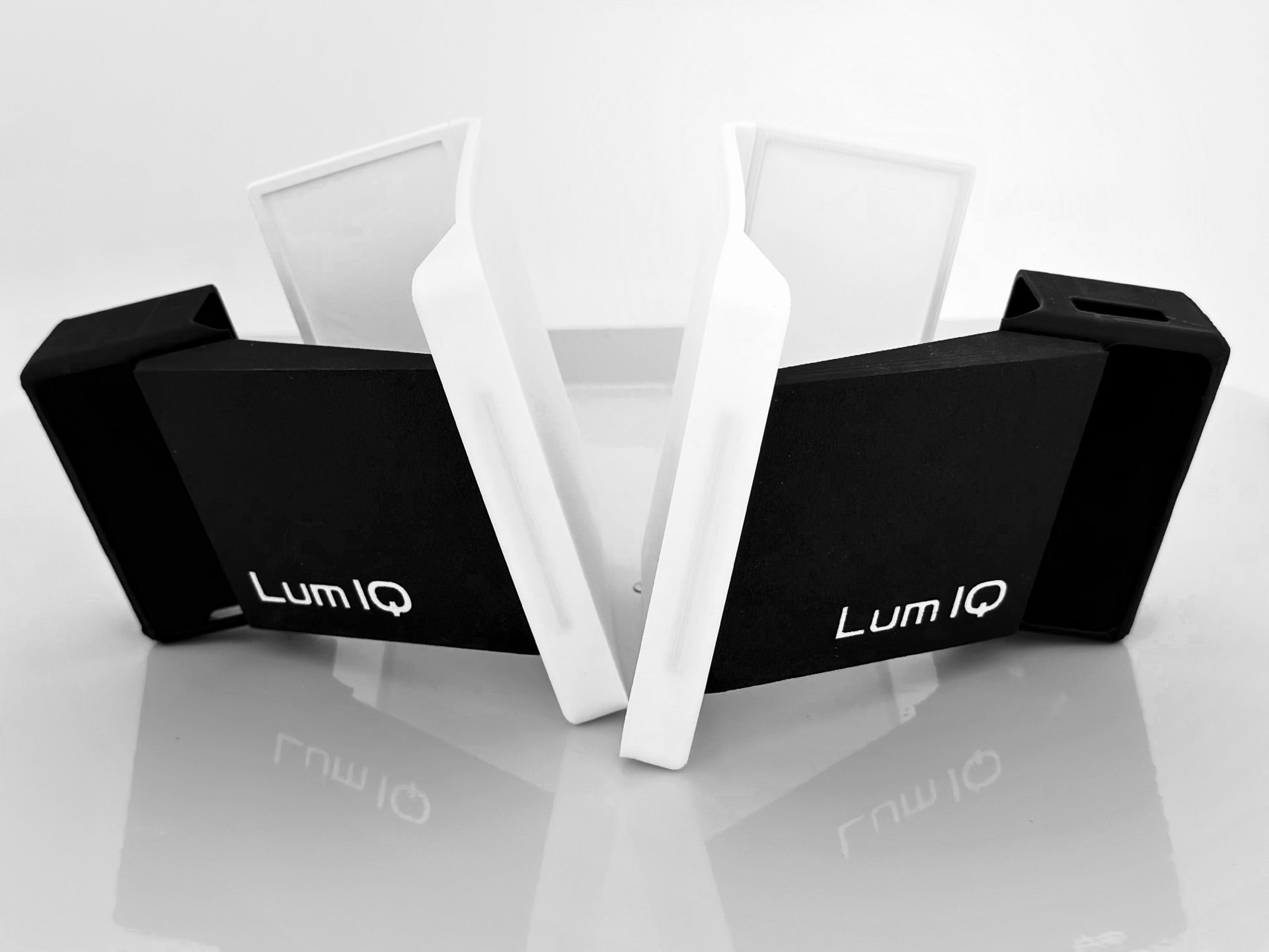 Lum IQ device on a reflective surface with a white background